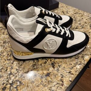 Louis Vuitton Runaway Black and White Sneakers with Gold Accent
